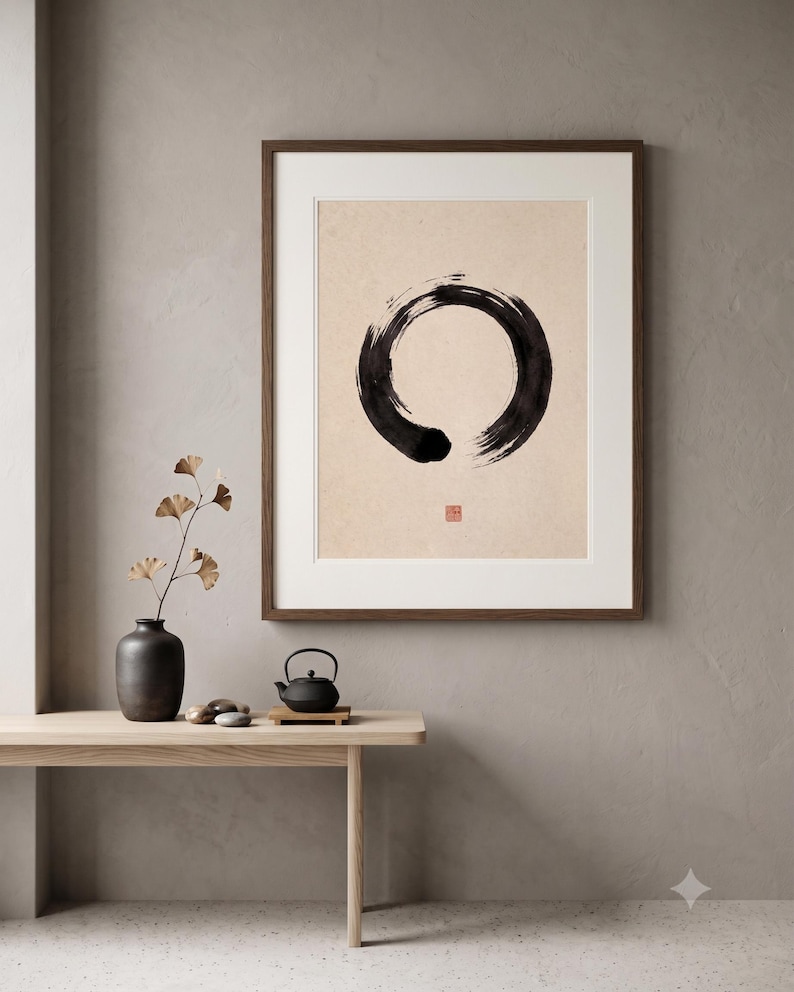 Framed Sumi Enso print displayed above a modern console table in a Japandi-inspired living room with neutral decor.