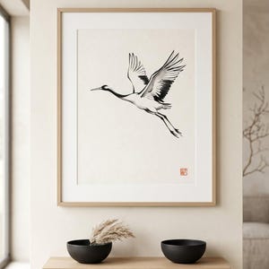 Crane Japanese ink tsuru bird print styled in a calm Japandi room — warm off-white. Calm & Oak.