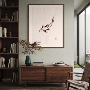 Koi ink koi fish with vermillion accent print styled in a calm Japandi room — warm off-white. Calm & Oak.