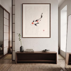 Koi ink koi fish with vermillion accent print styled in a calm Japandi room — warm off-white. Calm & Oak.