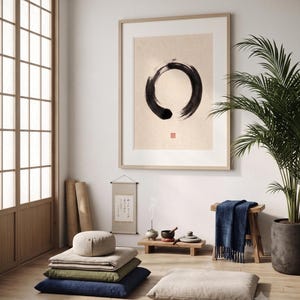 Framed Sumi Enso print displayed above a modern console table in a Japandi-inspired living room with neutral decor.