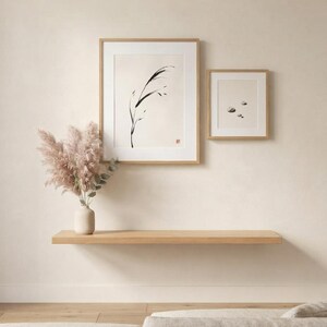 Minimalist Sumi-e Bent Reed print featuring Japanese ink brushwork of a graceful reed bending softly on warm white paper.