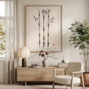 Three Bamboo three ink bamboo stalks print styled in a calm Japandi room — warm off-white. Calm & Oak.