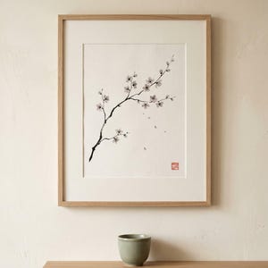 Cherry Branch sakura branch in ink print styled in a calm Japandi room — soft pink and cream. Calm & Oak.