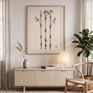 Three Bamboo three ink bamboo stalks print styled in a calm Japandi room — warm off-white. Calm & Oak.