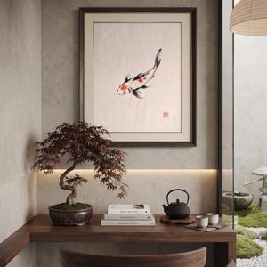Koi ink koi fish with vermillion accent print styled in a calm Japandi room — warm off-white. Calm & Oak.