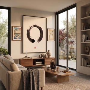 Framed Sumi Enso print displayed above a modern console table in a Japandi-inspired living room with neutral decor.