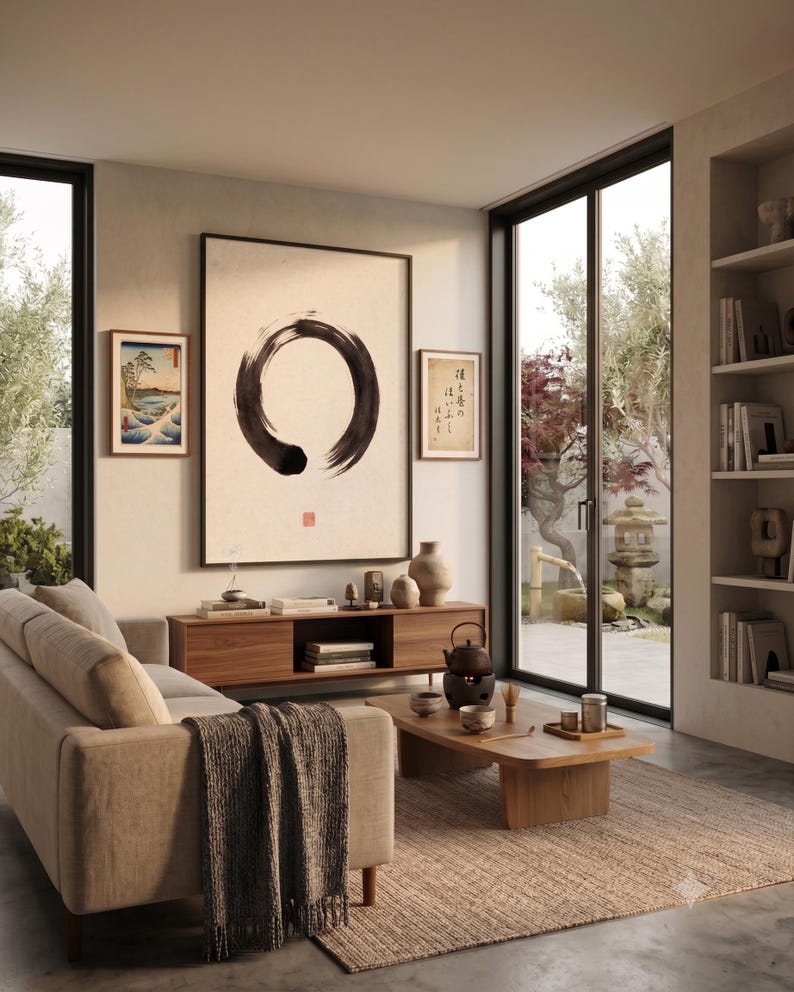 Framed Sumi Enso print displayed above a modern console table in a Japandi-inspired living room with neutral decor.