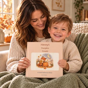 Grown-up and young boy sharing the square hardcover Henry's Pumpkin Parade book in a cosy autumn reading corner. Digital lifestyle mockup.
