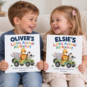 Personalised animal alphabet book for kids – two smiling children holding custom name ABC storybooks, a first birthday gift