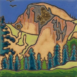 May include: A ceramic tile with a stylized depiction of a mountain range with a blue sky and green trees. The mountain is brown, orange, and gray with black outlines. The trees are blue and green with black outlines.