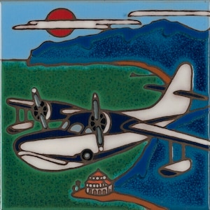 May include: A white and blue seaplane with two propellers flying over a green island with a small building. The seaplane is flying towards a blue and orange mountain range in the background. The sun is setting in the sky behind the mountains.