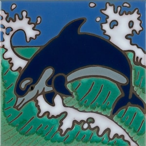 May include: A blue and gray dolphin leaping out of the water, with white foam and green waves behind it.