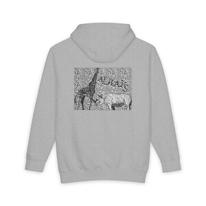 May include: A light gray hooded sweatshirt featuring a rectangular graphic on the back. The graphic displays a black and white illustration of a giraffe and a rhinoceros against a swirling, patterned background with the text ALWAYS printed in black.