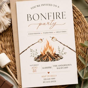 May include: A cream-coloured invitation card featuring the text YOU'RE INVITED TO A BONFIRE party, GOOD FRIENDS WARM FIRES GREAT TIMES, and event details. The design includes a watercolour illustration of a campfire with two roasting marshmallows.