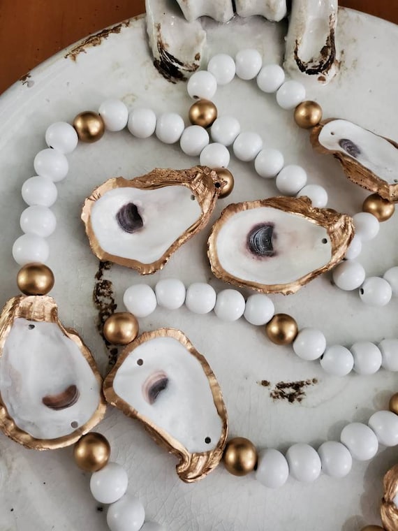 Gilded Oyster Shell Garland: Coastal Decor Beaded Garland