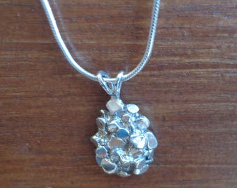 Sterling silver pendant with chain.