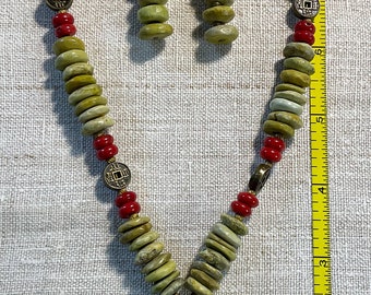 Buddha pendant necklace w/red coral/ green serpentine beads.