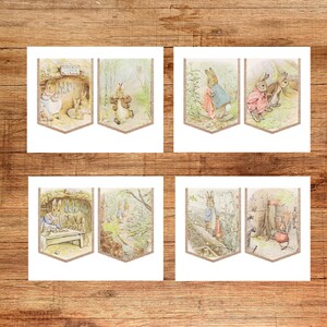 May include: Set of four illustrated pennant banners featuring scenes from a children's storybook. Each banner has a light brown glitter border and depicts rabbits in various settings, with soft pastel colors and detailed illustrations.