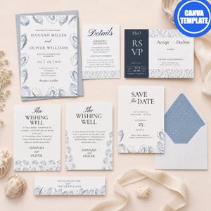 May include: A wedding stationery set featuring white cards with blue oyster shell illustrations and navy blue accents. The set includes an invitation, details card, RSVP card, save the date, wishing well cards, and an envelope with a blue patterned liner.