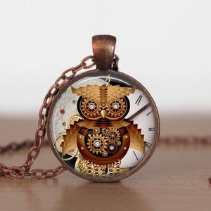 May include: A copper chain necklace with a round pendant featuring a steampunk owl design. The owl is made of gears and cogs, and its eyes are made of gold. The pendant is surrounded by a white clock face with Roman numerals.