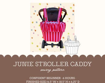 May include: A Junie Stroller Caddy sewing pattern featuring a pink and red striped fabric bag with a ruffled top edge, attached to a stroller handle. The text reads Junie Stroller Caddy sewing pattern, Confident Beginner, 6 hours, Finished Size: 14.5" W x 18.5" H x 6.25" D.