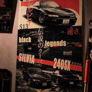May include: A rectangular poster featuring multiple images of a black Nissan Silvia S13 car. The design includes the text 1991, S13, black legends, SILVIA, 240SX, and Japanese characters. The layout displays the car from front and rear angles.