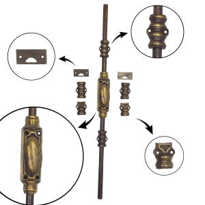 May include: A brass cremone bolt set featuring a long vertical rod, a central oval handle mechanism, decorative guides, and rectangular strike plates. The hardware displays a dark, aged patina with detailed molding on the mounting components.