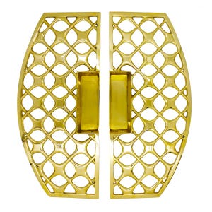 May include: A pair of polished gold-tone metal door handles featuring a symmetrical, open-work lattice design. Each handle has a curved outer edge and a rectangular recessed grip area in the center, with visible screw holes for mounting.