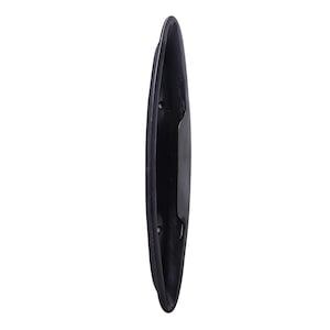 May include: A long, slender, matte black metal cabinet pull handle with a curved, recessed grip area. The hardware features two visible circular screw holes for mounting, positioned along the central spine of the elongated, narrow handle design.