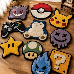 May include: A collection of ten tufted area rugs featuring various pop culture designs including a purple Gengar, a red and white Poké Ball, a yellow Pikachu, a black game controller, a blue Snorlax, a purple smiley face, a yellow star, a green mushroom, a blue flame, and a yellow question block.
