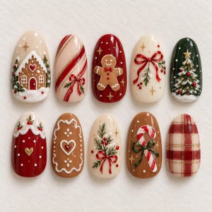 May include: A set of ten almond-shaped press-on nails featuring Christmas-themed designs including a gingerbread house, candy cane stripes, a gingerbread man, a red bow, a pine tree, red polka dots, a heart, holly, and plaid patterns.