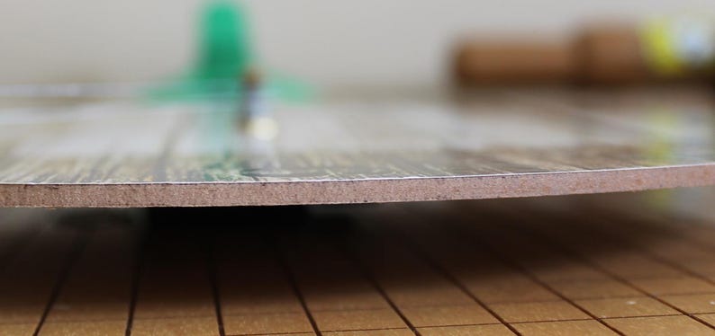 A close-up view of a wooden surface with a textured, wooden-like appearance.