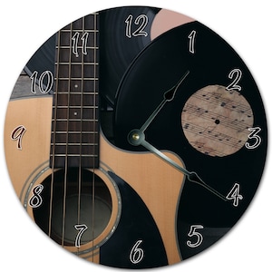 Gros plan sur horloge guitare : décoration murale silencieuse de 10,5 po.
