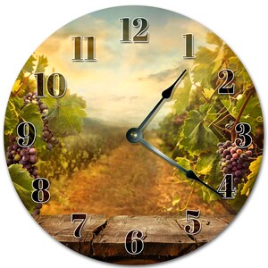 May include: A round clock with a rustic wooden background and a vineyard scene. The clock face has Roman numerals and black hands. The vineyard scene features rows of grapevines with ripe grapes.