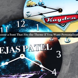 a clock with a space-themed design, including a planet and stars. The clock also has a personalized name on it.