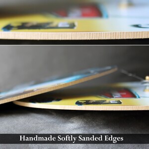 a close-up view of a handcrafted, softly sanded edge, with a blurred background that appears to be a wooden surface.