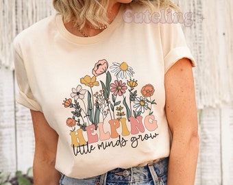 Helping Little minds Grow Shirt, Kindergarten Teacher Flower Shirt, KD Teacher Gifts, Teacher Life Shirt, Wildflowers Teacher Plus Size Top