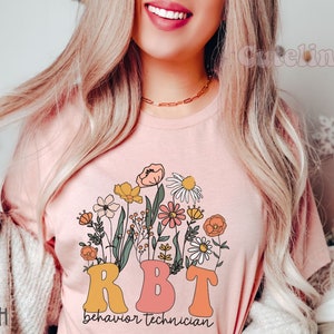 Wildflowers RBT Shirt, Behavior Specialist Shirt, ABA Shirt, Behavior Therapist Shirt, Behavior Technician Gifts, ABA gifts, autism worker Heather Peach