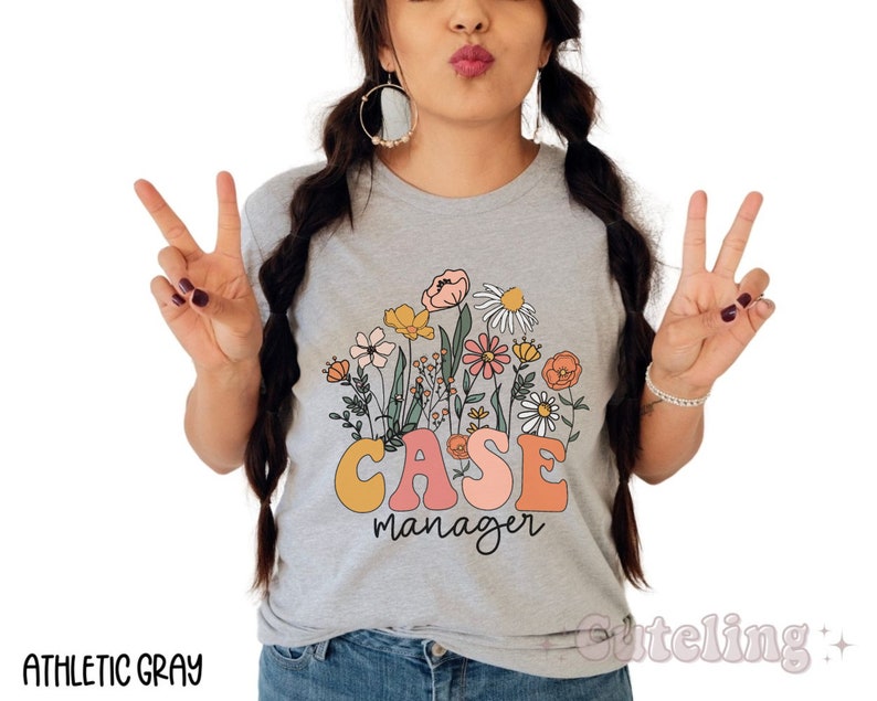 May include: A gray t-shirt with a floral design and the text "CASE manager" in colorful letters.