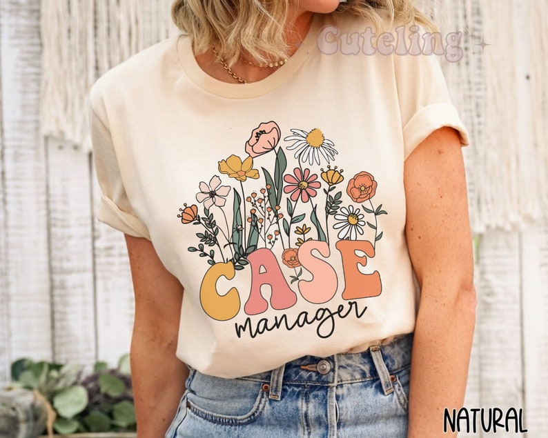 May include: A beige t-shirt with a floral design and the text "CASE manager" in pink, yellow, and orange letters.