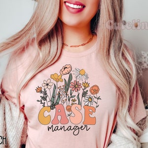 May include: A pink t-shirt with a floral design and the text "CASE manager" in a retro font.