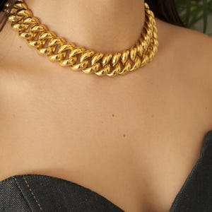 Vintage Monet goudkleurige chokerketting: gesigneerde statement-sieraden