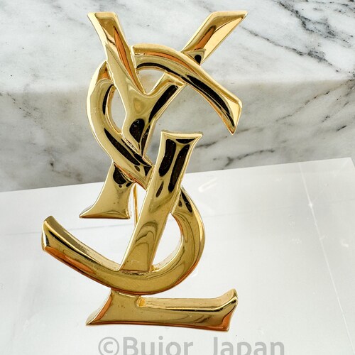 Vintage YSL Yves Saint Laurent Logo Brooch Pin: Gold Tone Jewelry