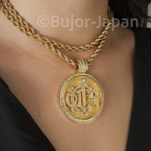 Vintage Christian Dior Gold Logo Pendant Necklace: Swarovski Crystal Insignia
