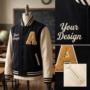 May include: A black varsity jacket with cream-colored sleeves, featuring a textured gold letter A patch on the chest and the embroidered text Your Design. The jacket has a snap-button front, striped ribbed collar, cuffs, and hem, and side pockets.