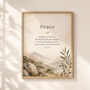 Könnte beinhalten: Ein gerahmter Wandkunstdruck mit einer Aquarelllandschaft aus Bergen und Felsen sowie einem Olivenzweig auf der rechten Seite. Der Text lautet: Peace, Jesus gives you His peace. Not the kind of peace the world gives, but peace deep within your heart. Do not be afraid. Let your heart be still. John 14:27.