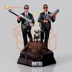 May include: A detailed figurine set featuring two figures in black suits and sunglasses holding silver futuristic weapons, standing beside a small pug wearing a black suit and sunglasses, all positioned atop a brown creature on a black base labeled MIB.