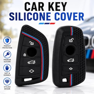 May include: Two black silicone car key covers featuring a honeycomb texture on the sides and a blue, white, and red stripe detail. The covers display white icons for locking, unlocking, and trunk release functions, with text reading CAR KEY SILICONE COVER.