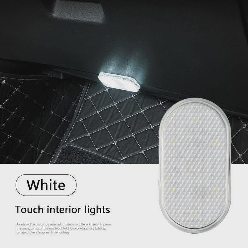 May include: An oval-shaped white touch interior light for vehicles with a textured surface. The light is shown illuminated in a dark car interior. Text on the image reads: White, Touch interior lights, and additional descriptive text.